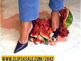 Watermelon crushing under high heels