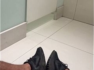 Big, hairy, very hard penis on the bathroom floor of the shopping mall.