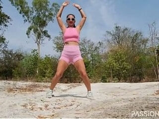 Workout squats and jumping in public park