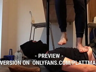 Master trampling and jumping barefeet on the poor slave