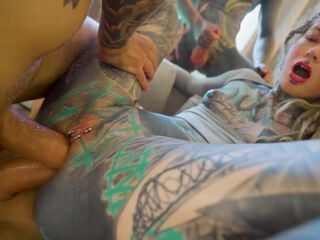 Inked slut loves being stuffed with huge dicks