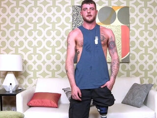 BondageBros Tattooed Hunk Nick Blue Eyes tugs his veiny meat