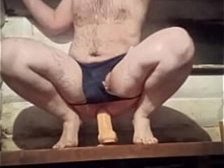 A Russian gay man with the smallest dick in the world rides a huge 12-inch dildo!