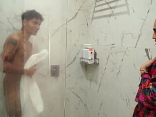Big-assed stepmom ends up fucking her skinny stepson after spying on him in the shower