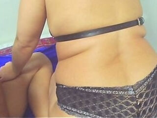 SUBTITLES - Real cuckold - A 43-year-old married and sensual woman uses a leather harness and black lace panties to tease on video calls.