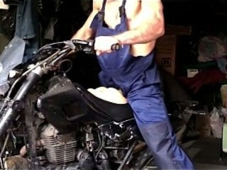 A muscular mechanic gets turned on at work and has sex with a motorbike whilst repairing it