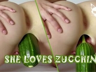 A woman shoves a huge zucchini into herself. Crazy food fetish.